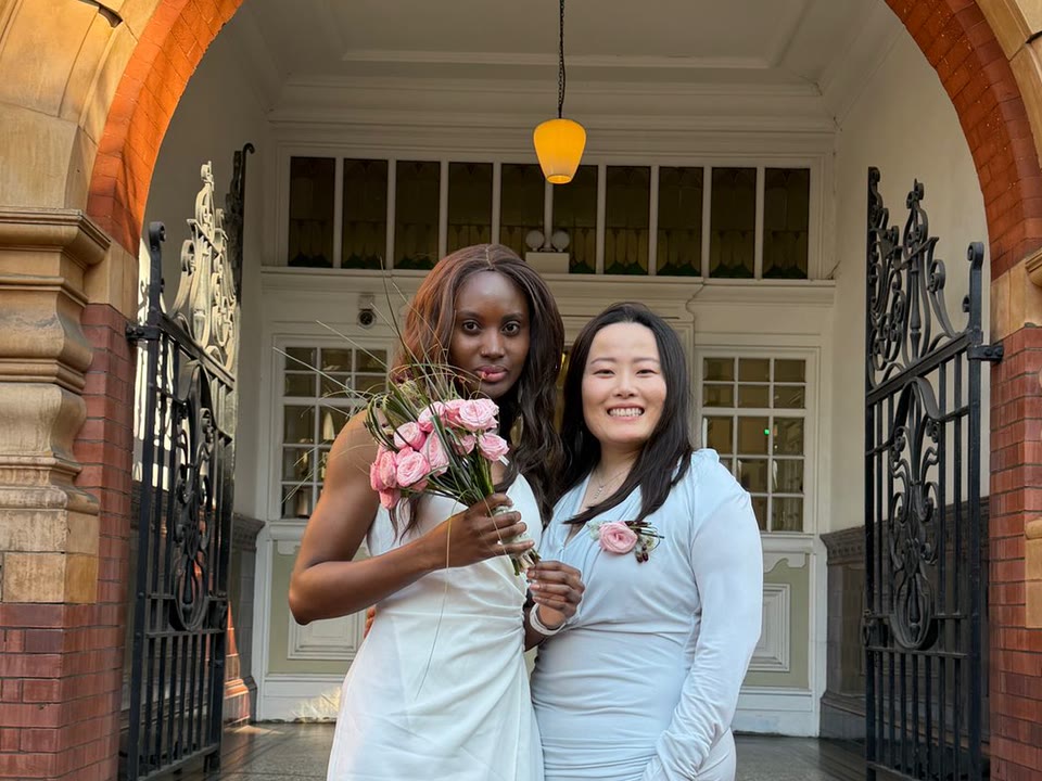 Tina and Tai together outside the registry office on their civil partnership day